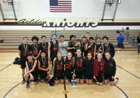 The Boys Varsity Team with their trophy after winning their tournament and several members of the Girls Varsity team, who placed third, with their trophy.