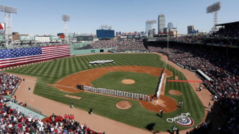 Two P-51s flyover Fenway Park during opening ceremonies before a baseball game between the Boston Red Sox and the Baltimore Orioles at Fenway Park in Boston Monday, April 8, 2013. (AP Photo/Winslow Townson)